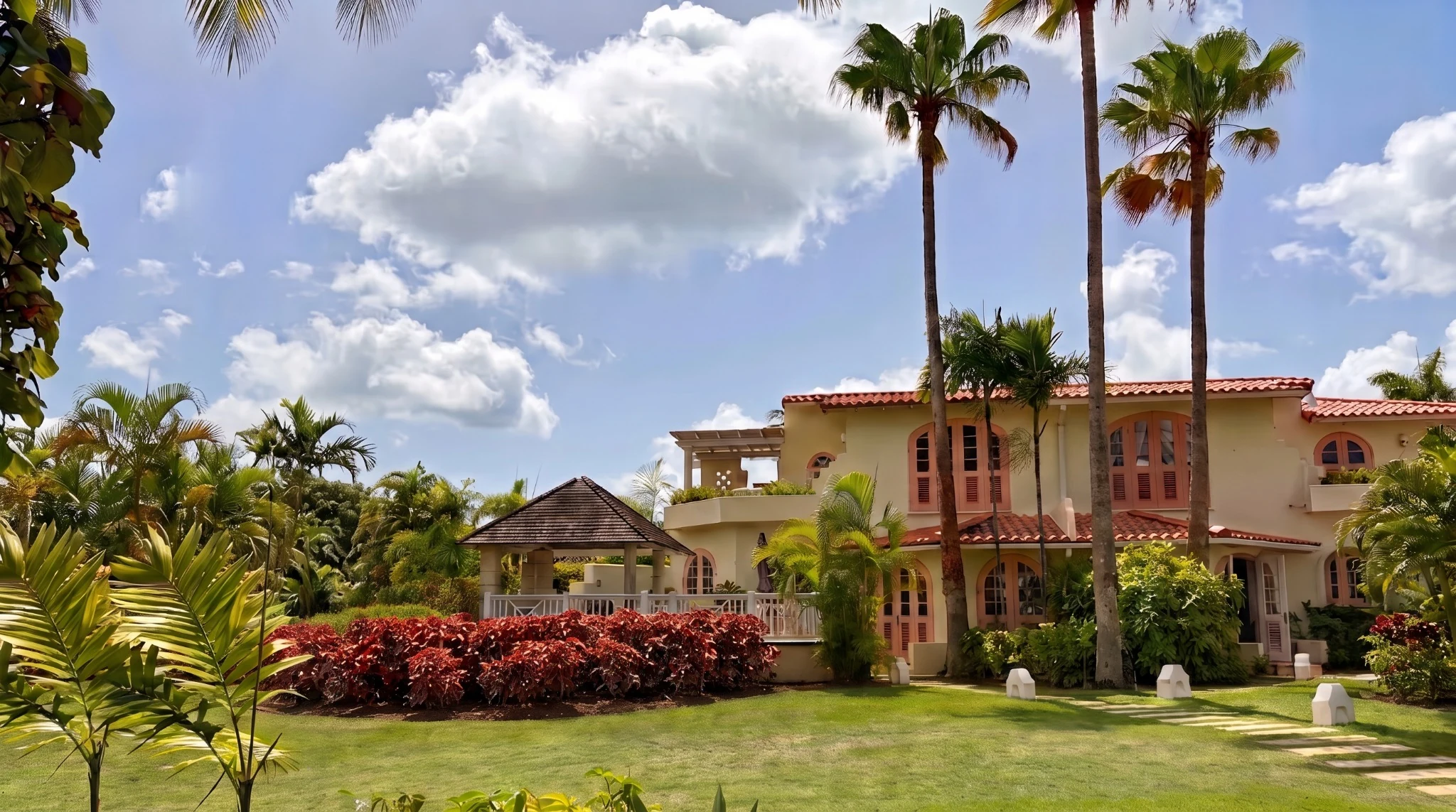 Full rear view of Palm Breeze Villa with gazebo and tropical garden